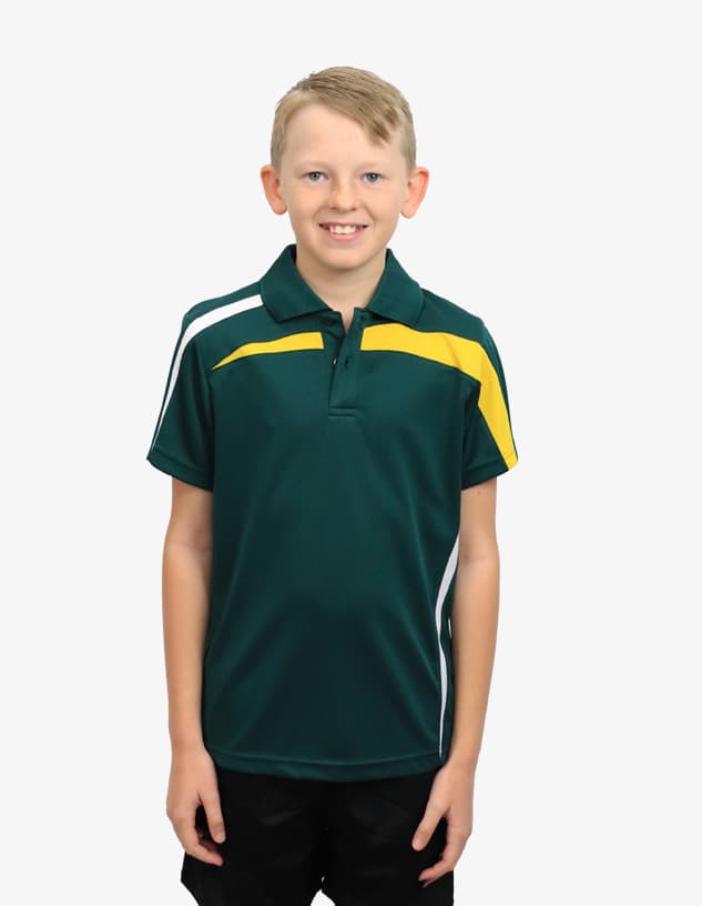 A young boy wearing a green polo shirt with yellow and white accents, featuring a logo on the chest.