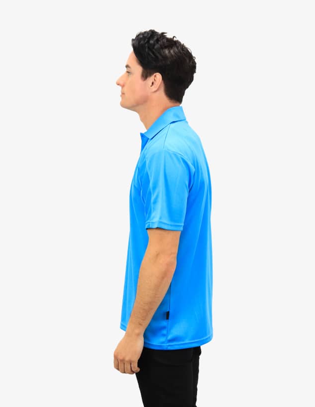 A blue polo shirt displayed on a model, featuring a logo and a classic cut.