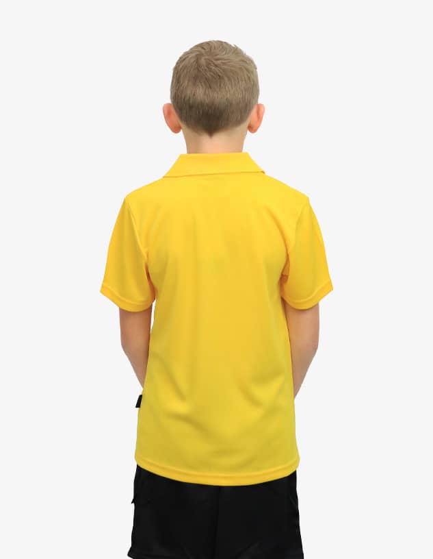 A back view of a child wearing a bright yellow polo shirt. The shirt has a logo on the side.