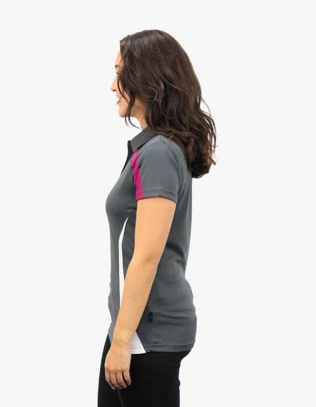 A grey polo shirt with pink accents and white side panels. The shirt features a logo.
