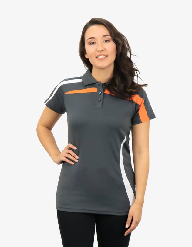 A grey polo shirt featuring orange and white accents, modelled by a woman with long, wavy hair.