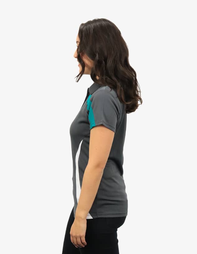 A grey polo shirt with turquoise accents and a logo, displayed on a model from the side.