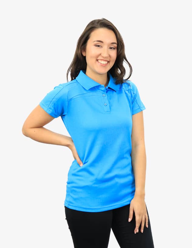 A blue polo shirt modelled by a smiling woman, featuring a collar and buttons, with a logo visible.