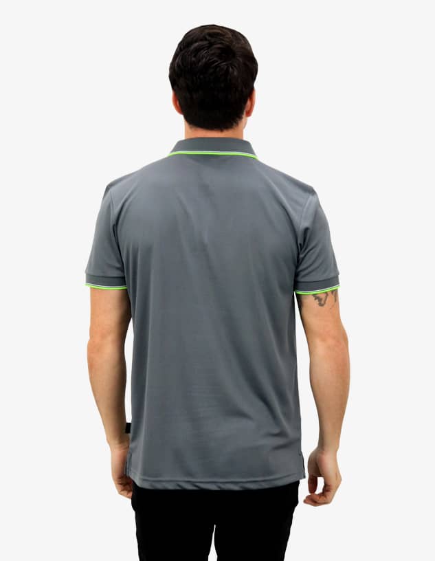 A grey polo shirt with a contrasting green collar, featuring a logo on the back.