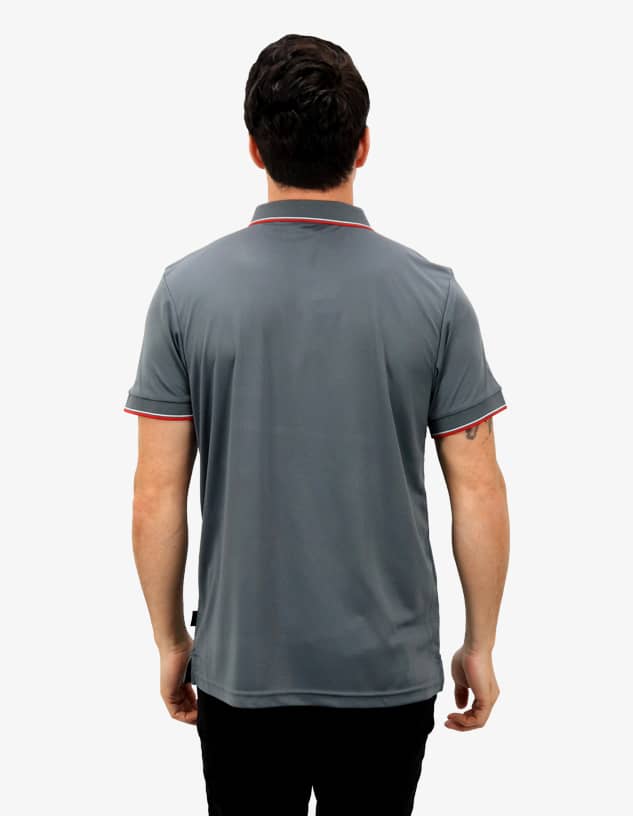 A grey polo shirt with contrasting red trim, featuring a logo on the back, modelled by a person.