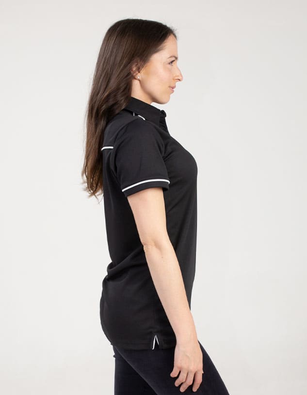 A black polo shirt featuring white detailing, shown on a model from the side. It has a logo on the fabric.