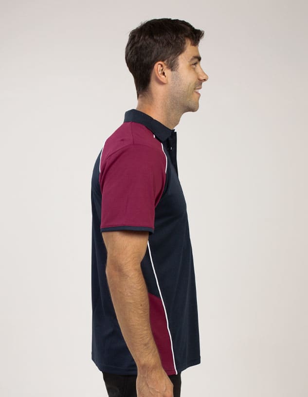 A polo shirt featuring navy blue and maroon colours with a logo and white detailing, displayed on a male model.
