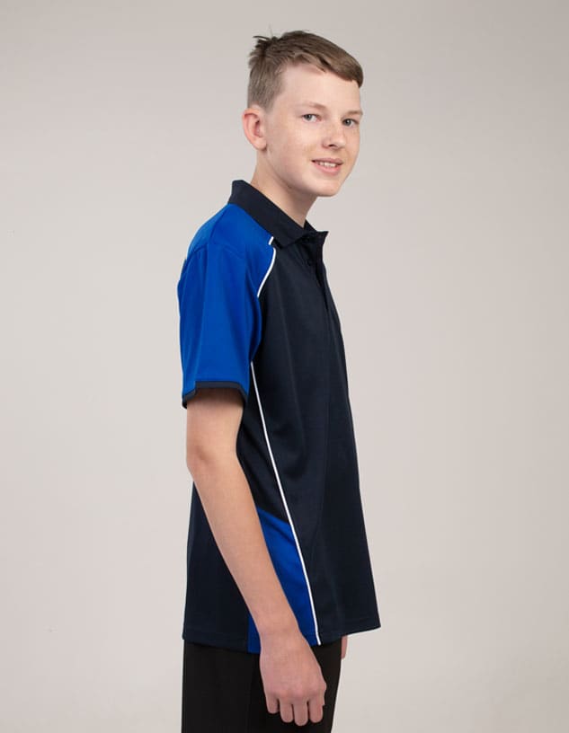 A polo shirt featuring navy and blue colours, designed with a logo, displayed on a model in profile.