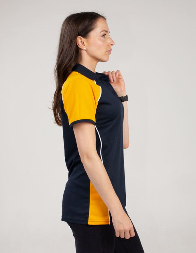 A navy and yellow polo shirt featuring a logo and a fitted design, displayed on a model.