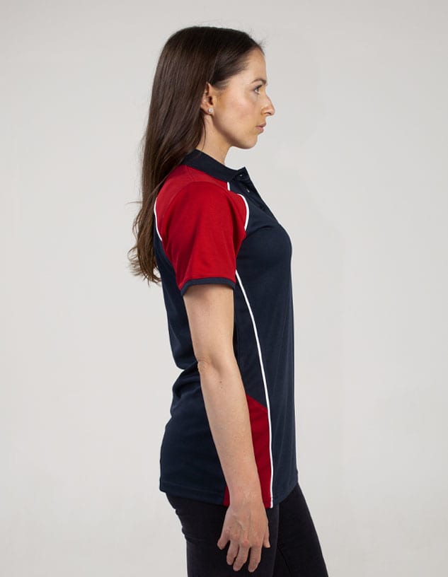 A polo shirt featuring navy blue and red colours, with a logo on the chest. It has a classic collar and short sleeves.