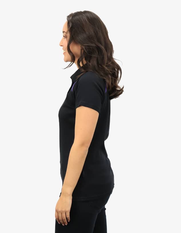 A black polo shirt displayed on a female model, featuring a simple design and fitted silhouette.
