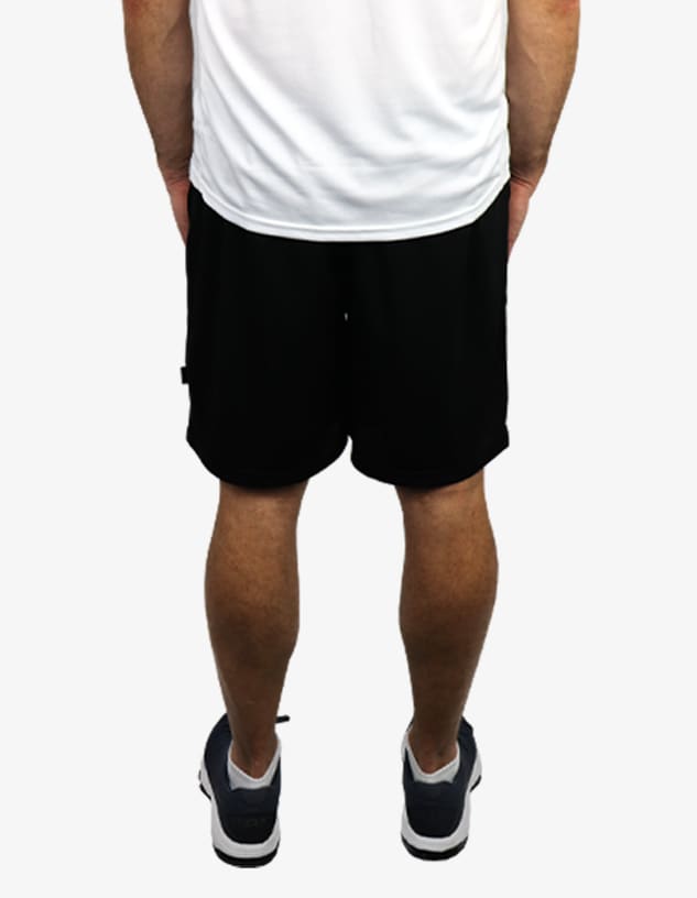 Black sports shorts viewed from the back, featuring a waistband and a logo.