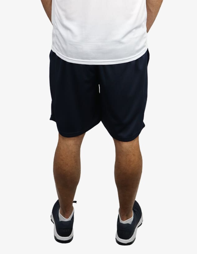 Navy sports shorts viewed from the back, featuring an elastic waistband and a logo.