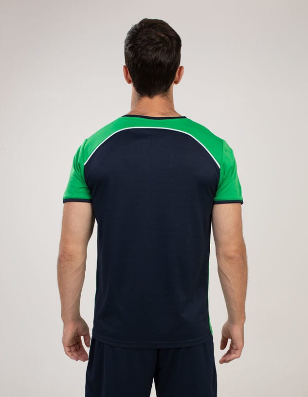A man is wearing a Bst2045 T-shirt with a green and navy design, featuring a logo on the back.