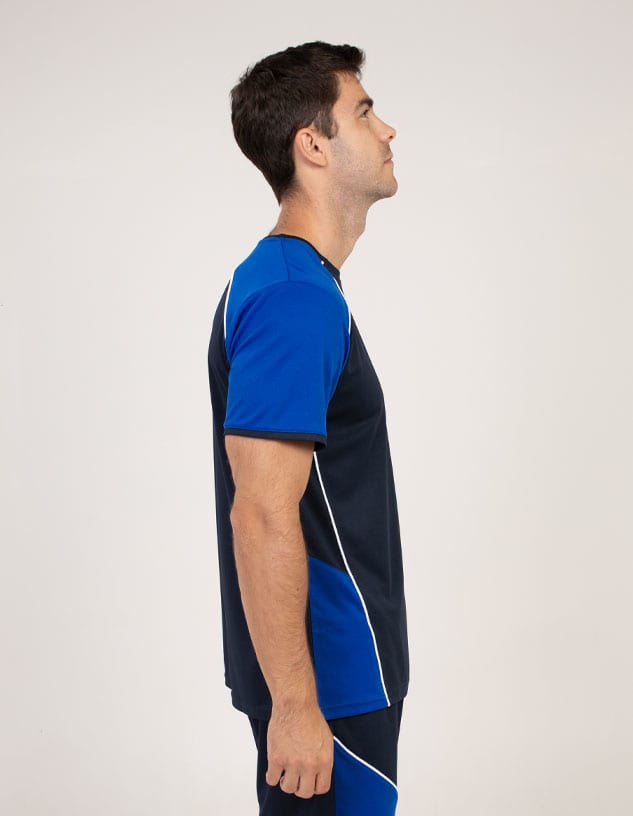A side view of a man wearing a navy blue and blue T-shirt with contrasting white detailing and a logo.