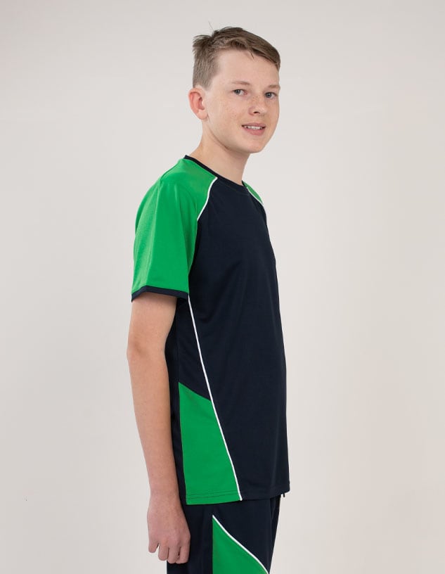A person wearing a black and green T-shirt with contrasting panels and a logo on the side.