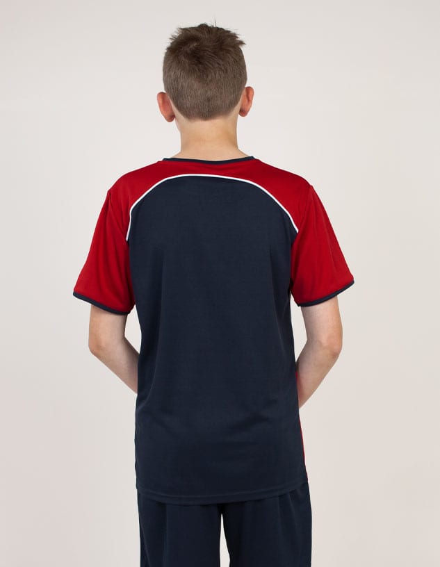 A boy wearing a red and navy blue T-shirt, viewed from the back, featuring a logo on the upper back.