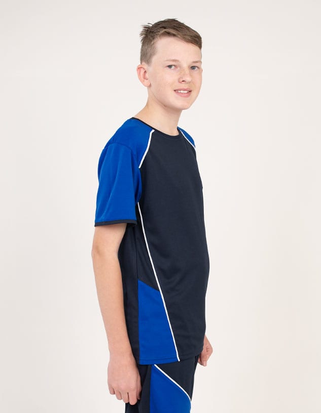 A boy wearing a black and blue T-shirt with white detailing and a logo on the chest.