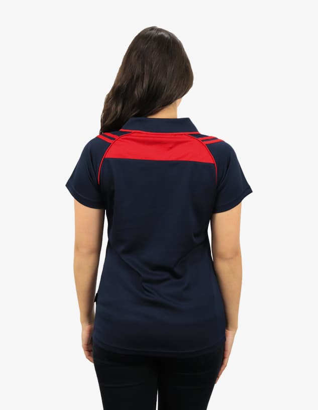 A navy polo shirt featuring a red upper panel and a branded logo. Ideal for casual wear.
