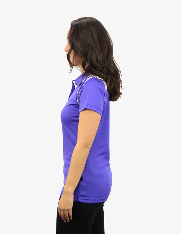 A purple polo shirt featuring a logo, displayed on a female model from the side.