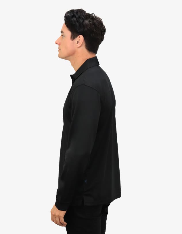 A black polo shirt displayed on a model, featuring a collar and a side profile view. The shirt has a logo.