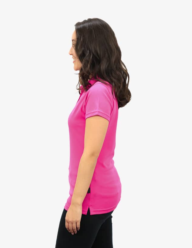 A pink polo shirt displayed on a female model, featuring a simple design and a logo.