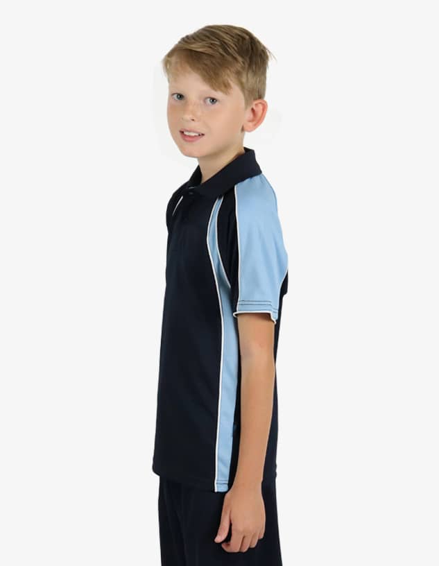 A boy wearing "The Rozella" polo shirt, featuring a black body with light blue accents and a logo.