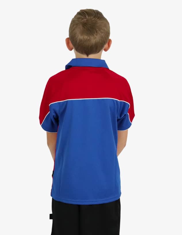 A polo shirt in blue and red with a white accent, displayed from the back on a child. It features a logo.