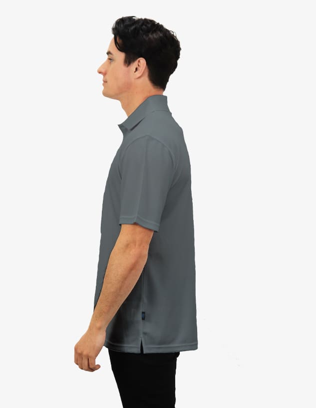 A grey polo shirt displayed on a model from the side, featuring a logo on the fabric.