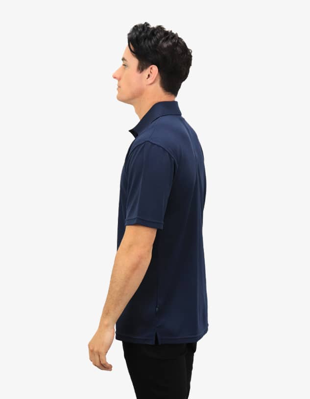 A navy blue polo shirt featuring a logo, displayed on a model from a side profile.