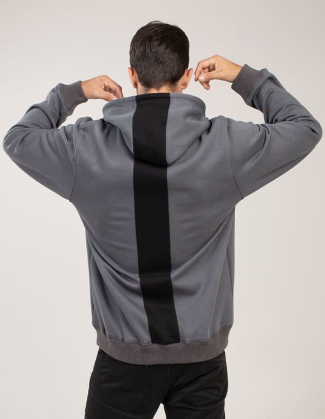 A grey hoodie with a black vertical stripe on the back and a drawstring hood. Features branding.