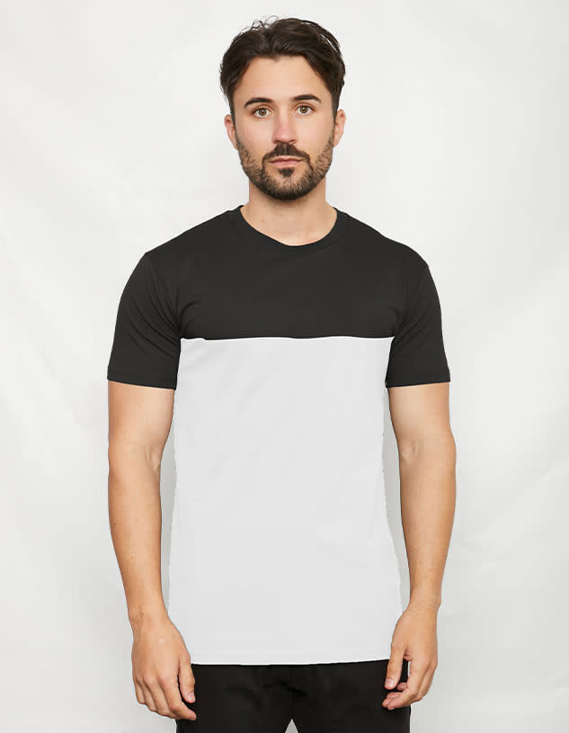 A two-toned T-shirt featuring a black upper section and a white lower section, with a fitted design.