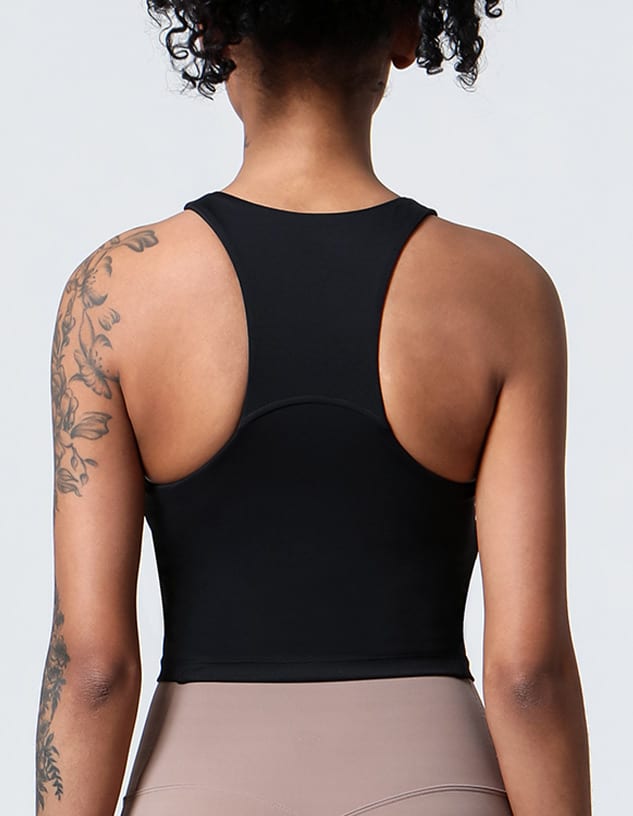 A black ladies' crop top with a racerback design, featuring a logo and a fitted silhouette.