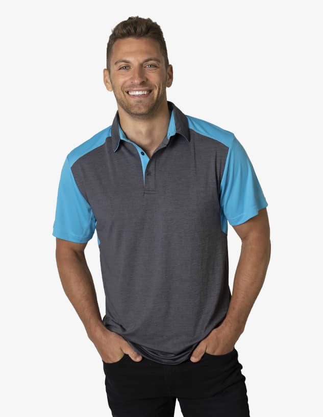 A grey and blue polo shirt worn by a smiling man, featuring a logo on the chest.