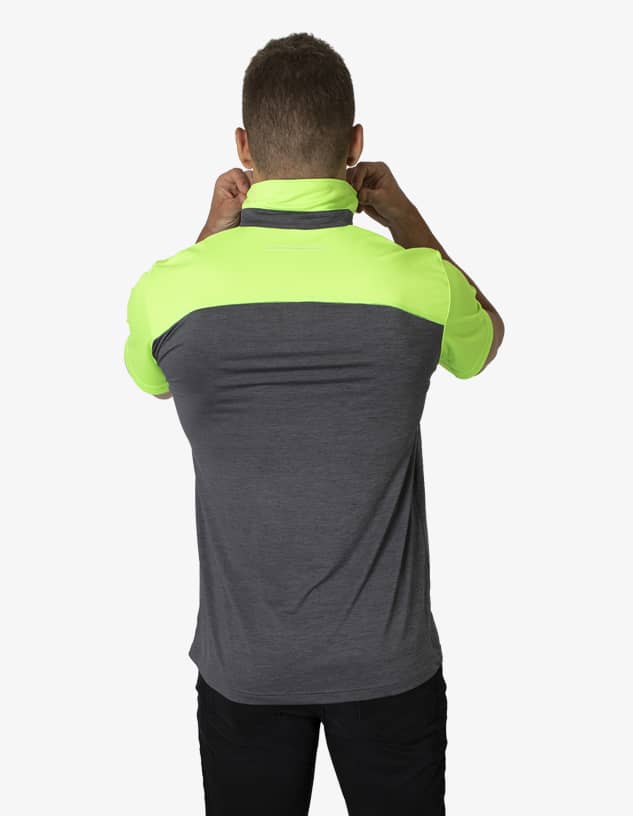 A polo shirt with a grey body and bright neon green collar and shoulders. It features a logo on the sleeve.