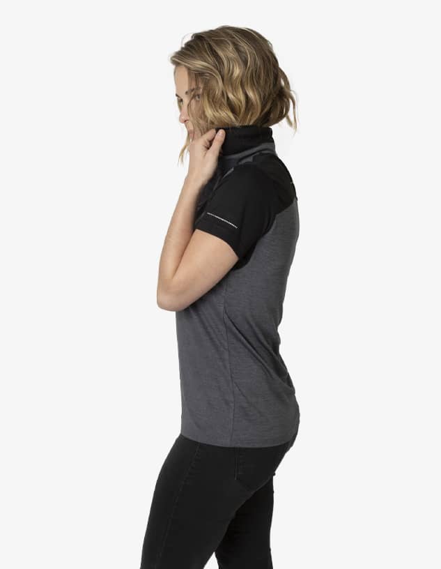 A polo shirt featuring a black and grey design, with short sleeves and a high collar. It has a logo on it.