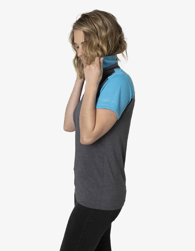 A polo shirt in grey with a blue collar, featuring a logo on the side, displayed on a model.