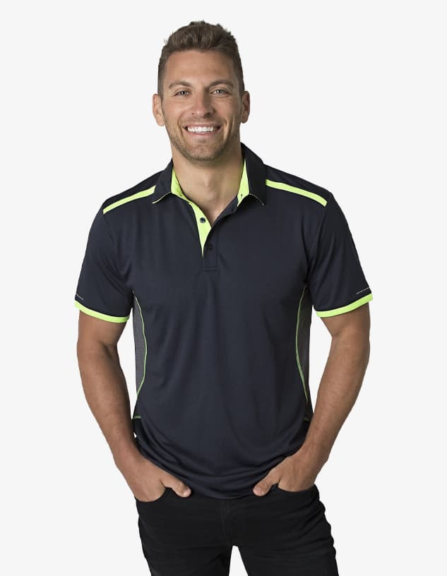 A navy polo shirt with lime green accents, featuring a collar and short sleeves, worn by a smiling male model.