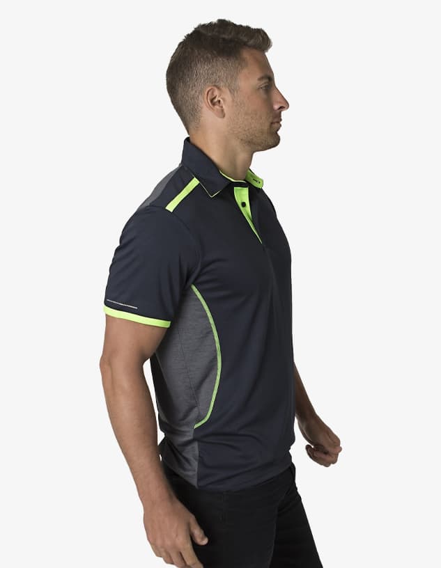 A polo shirt in navy blue with lime green accents and a logo. It features a modern design and short sleeves.