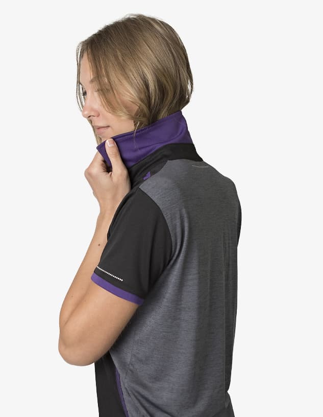 A polo shirt in black and grey with purple accents, featuring a collar and branding.