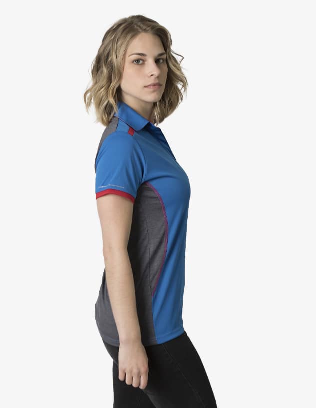 A polo shirt in blue with grey and red accents, featuring a logo on the chest, displayed on a model.