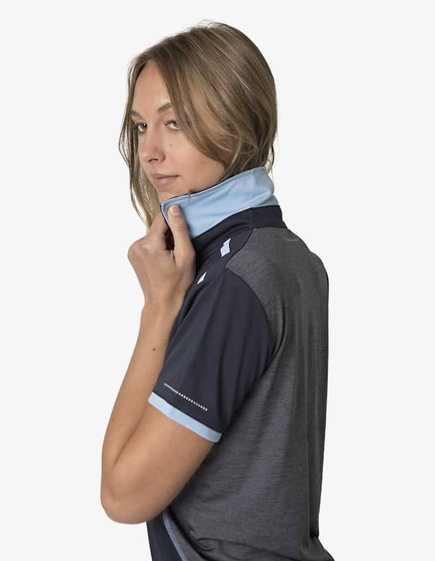 A grey and blue polo shirt with a collar, featuring a logo on the sleeve and a stylish design.
