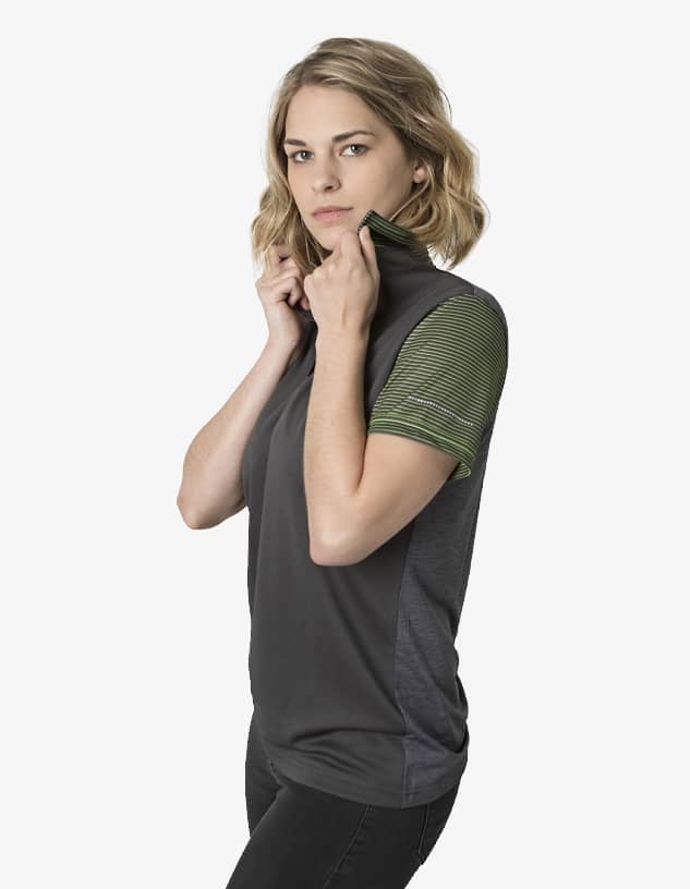 A polo shirt featuring a dark grey body and green striped sleeves, with a collar being adjusted by a model.