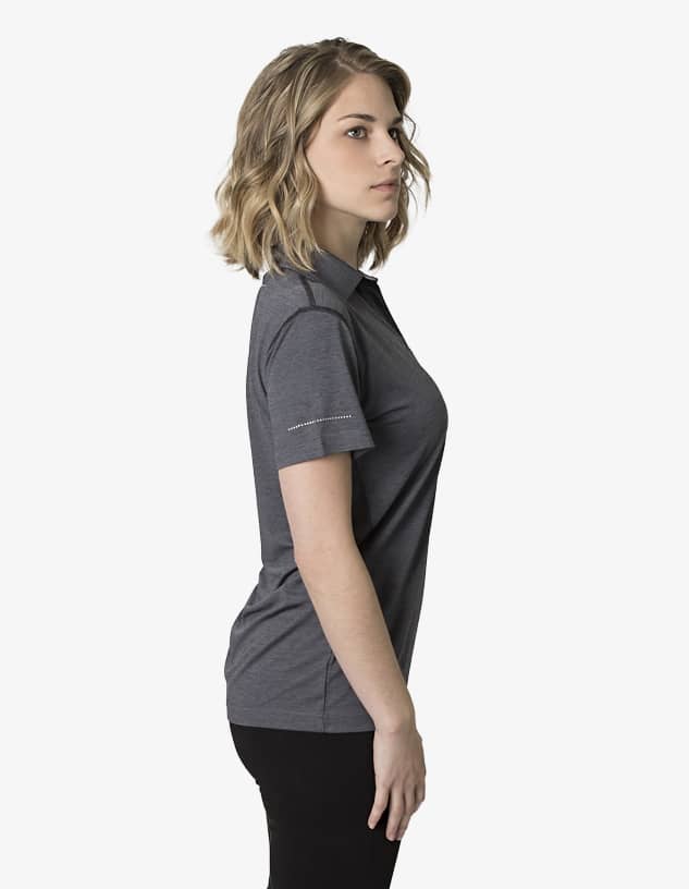 A grey polo shirt displayed on a model from a side view, featuring a logo on the sleeve.