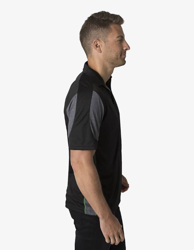 A polo shirt in black with grey accents, featuring a logo. Man shown wearing it in profile view.