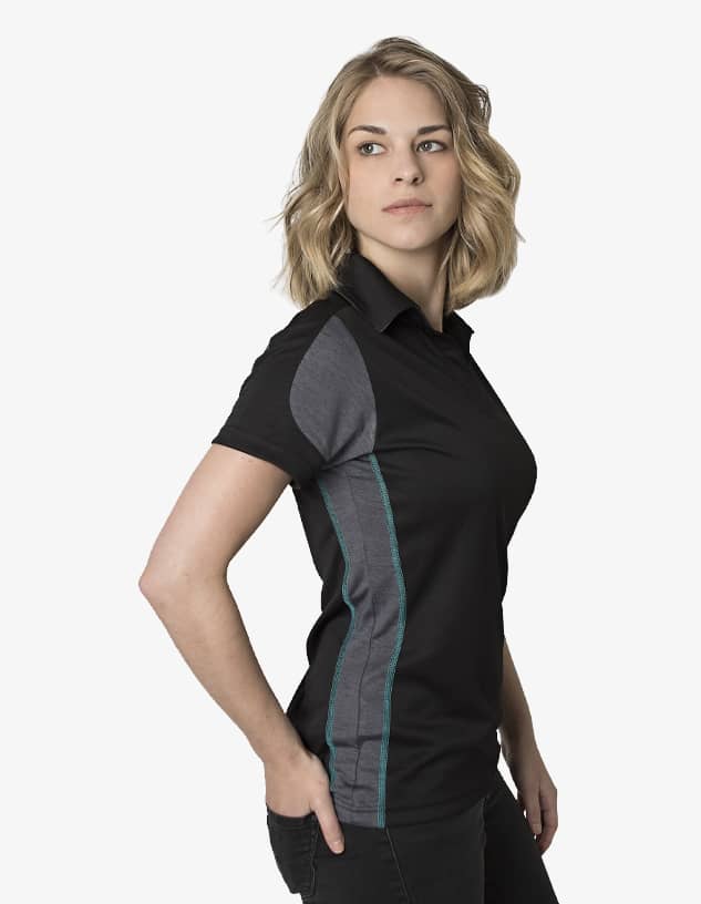 A women's polo shirt in black with grey and teal panel detailing, featuring a logo on the chest.