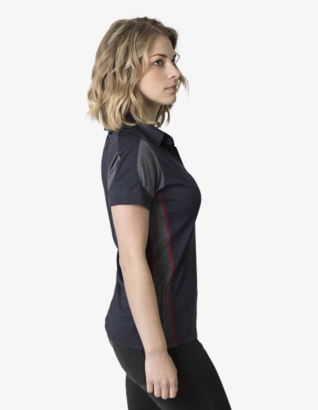A women's polo shirt in navy with contrasting panel details and a logo. The shirt features a classic collar and short sleeves.