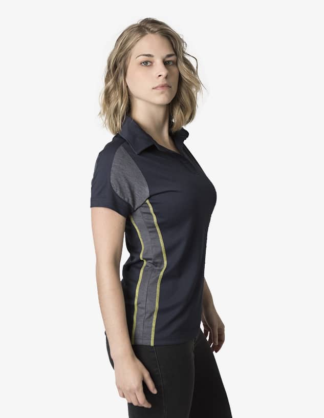 A women's polo shirt in navy with grey side panels and green accents. It features a collar and short sleeves.