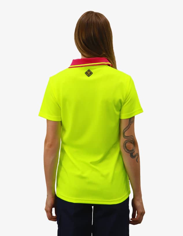 A polo shirt in bright yellow with a contrasting pink collar, featuring a logo on the back.