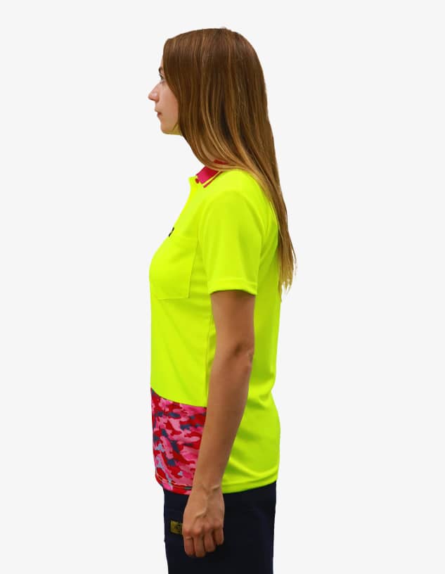 A bright yellow polo shirt with a pink camo pattern on the lower part and a logo on the chest.